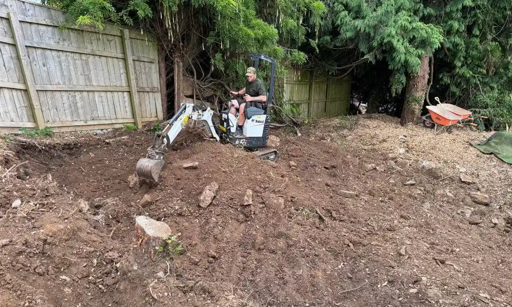 Landscaping Pricing - Digging Up Soil With Machinery - Jackson Landscaping Ltd