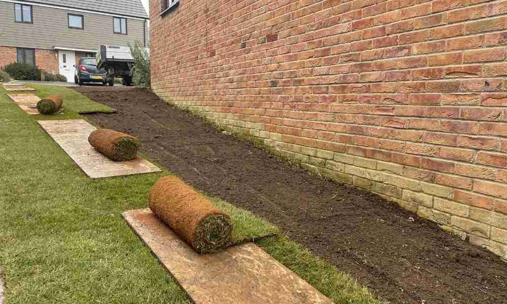 Premium turf rolls being installed